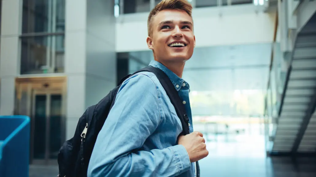 male student with backpack