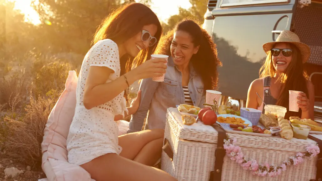 three women having a picnic