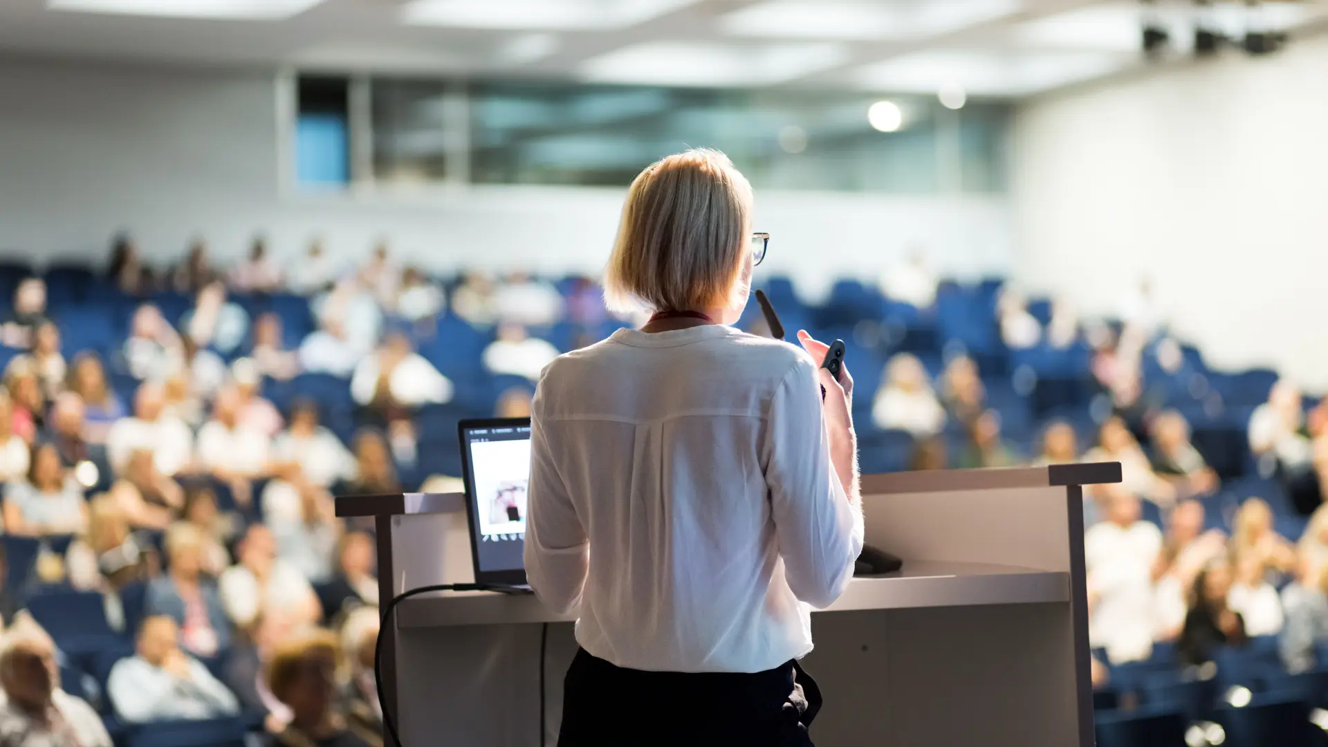 professor lecturing from podium