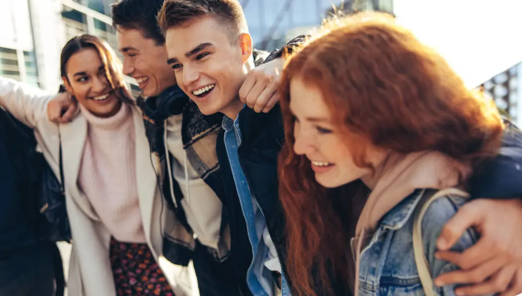college students hugging