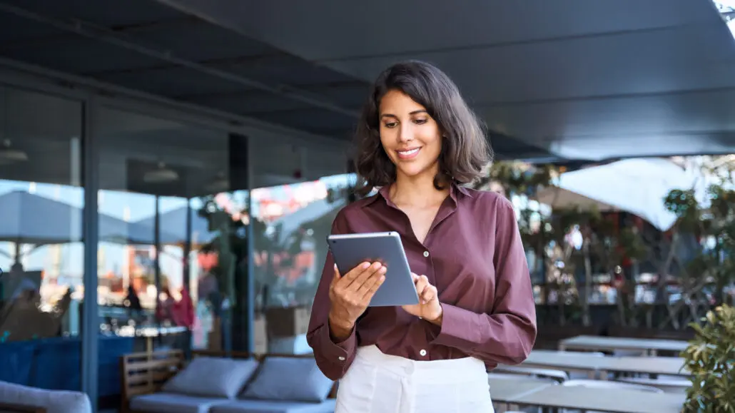 woman with an iPad in an outdoor office space