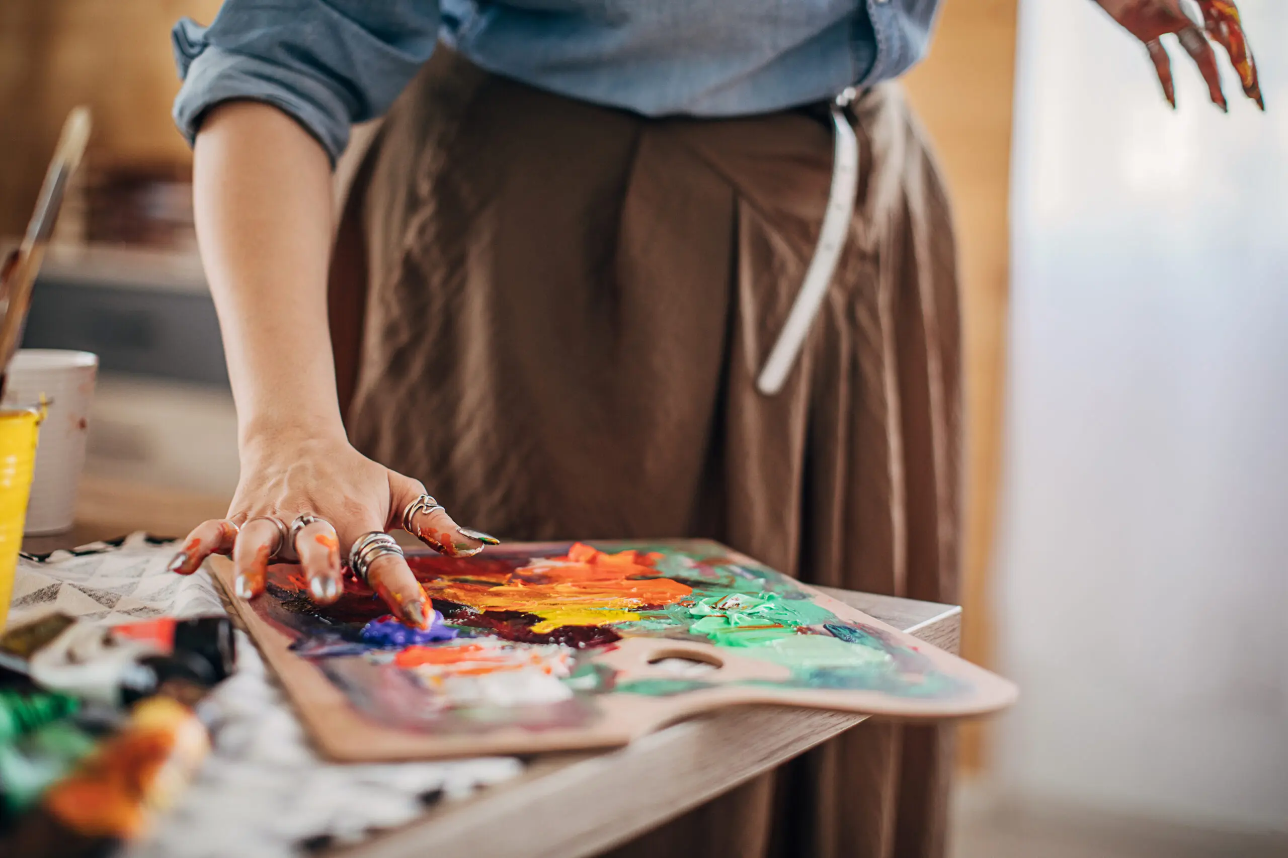 artist painting with fingers