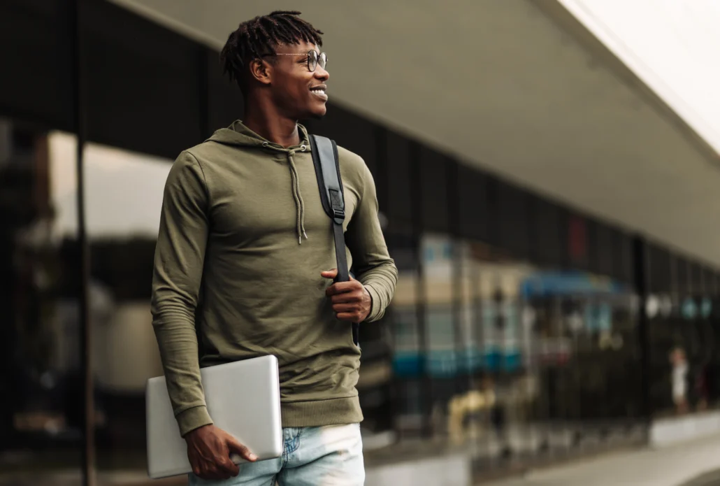 Black student walking on a college campus