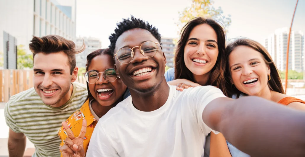Group of college students looking into camera