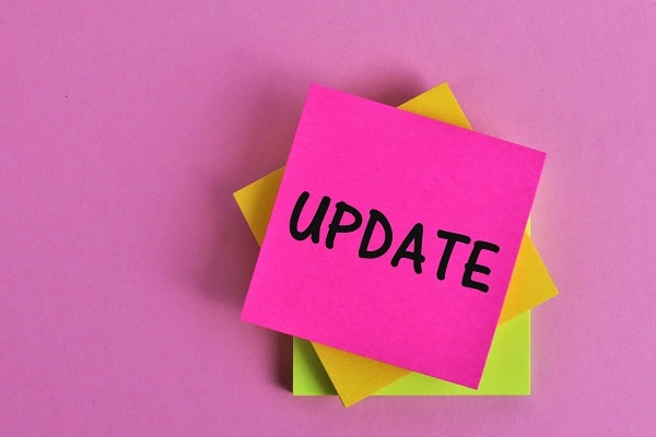 Several post it notes stacked and the top one says update