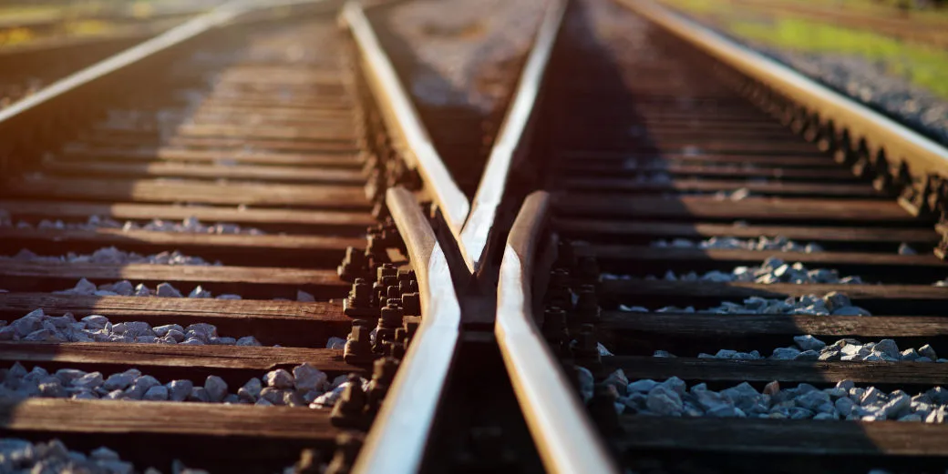 Decision-Making in Crisis showing a set of railroad tracks with two different directions it can take you.
