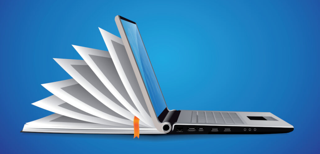 A laptop sittle on a blue background.