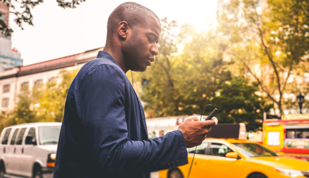 Young adult commuter going at work in the city streets, Soho New York.