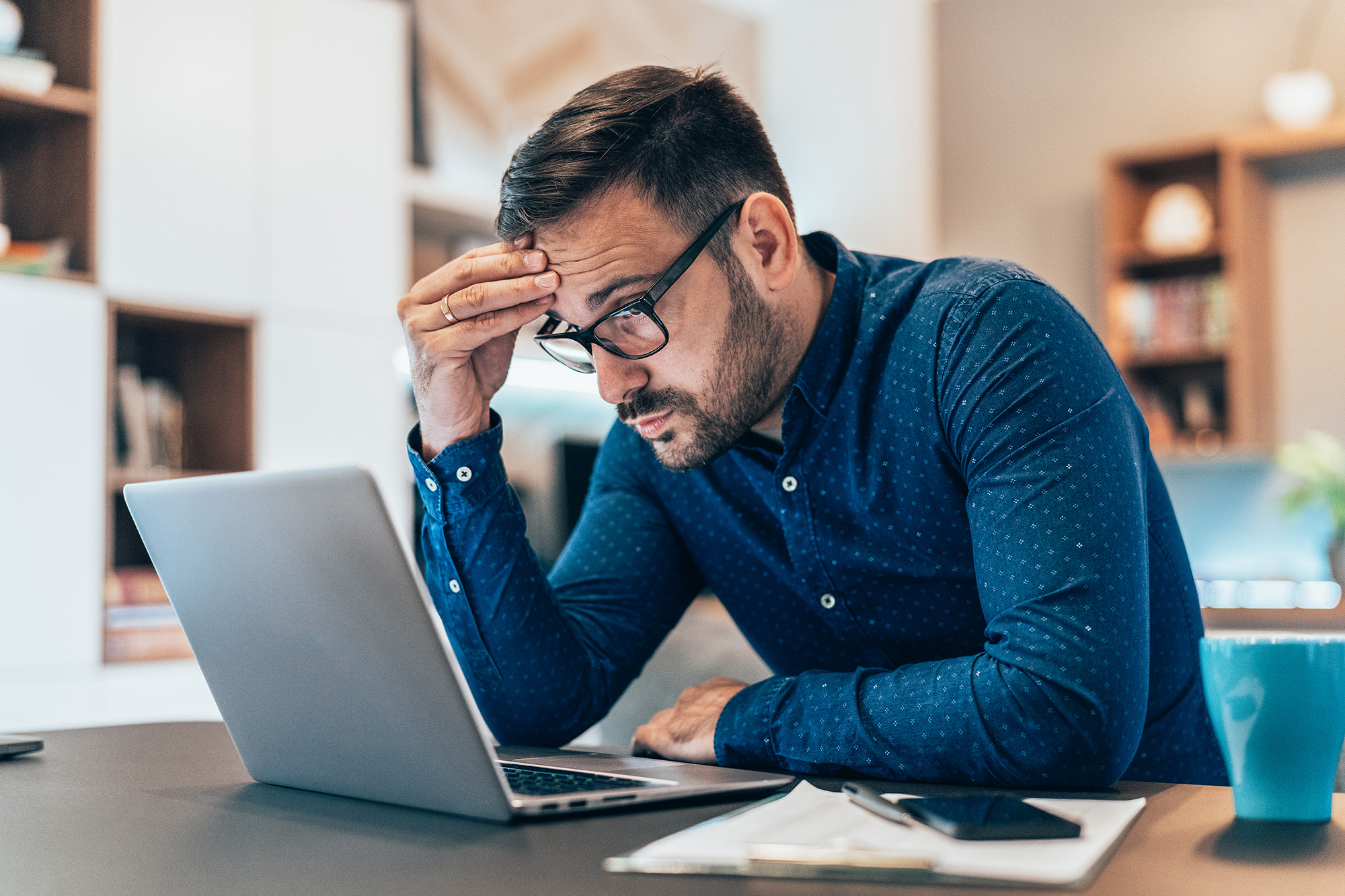 man frustrated over is computer work.