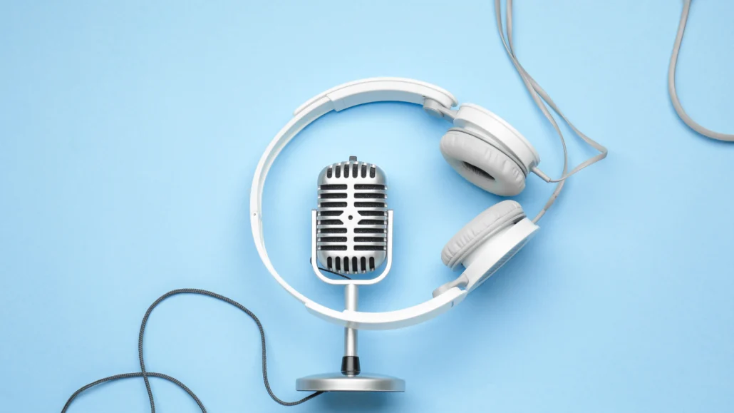 old-style microphone and set of headphones.