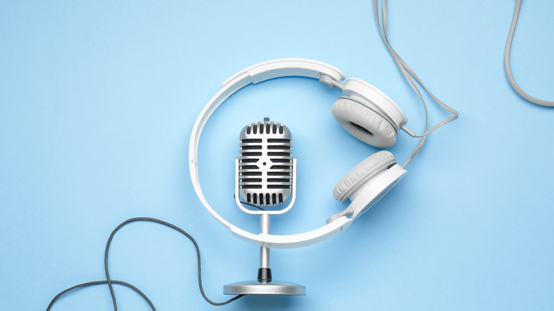 old-style microphone and set of headphones.