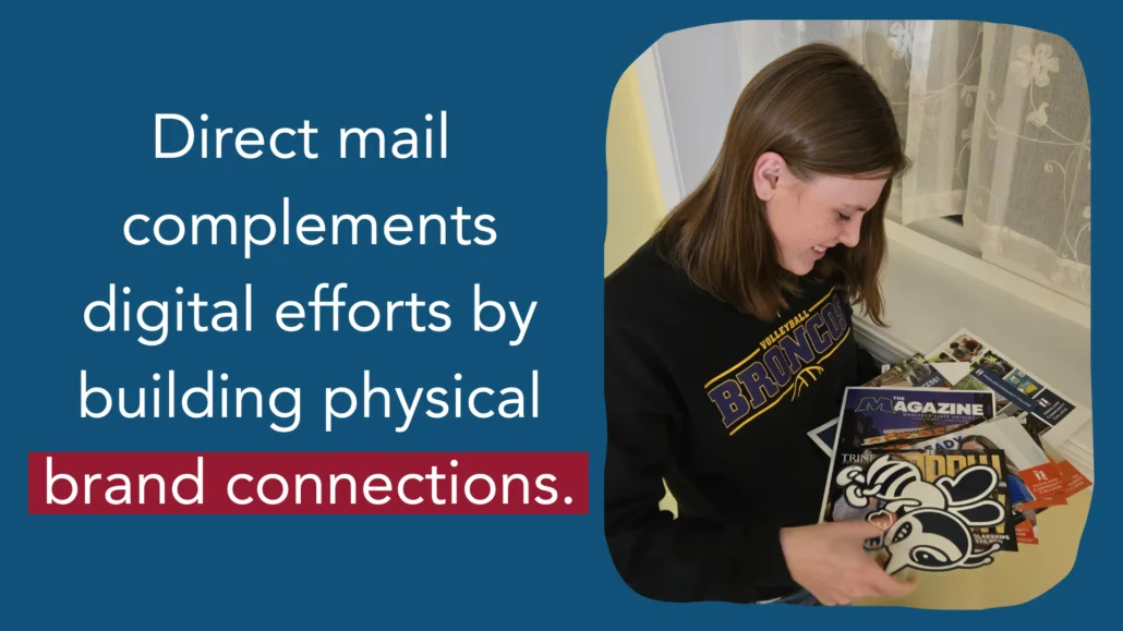 Young adult holds brochures received in the mail.