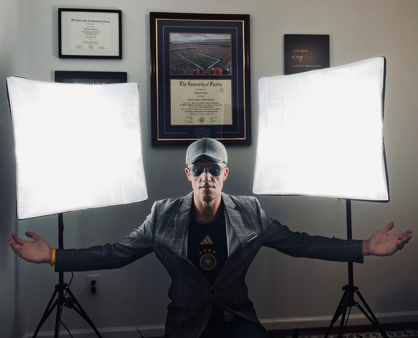 Chris Rapozo by two lighted video screens
